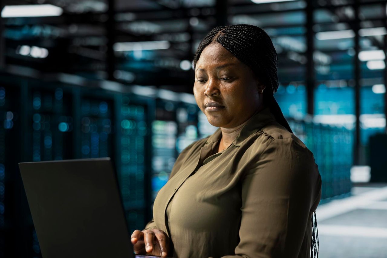 Engineer at a workstation in a data center