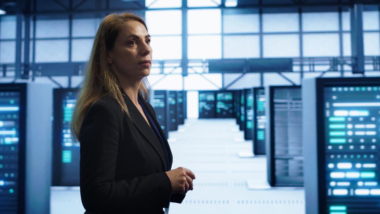 Leader standing in a data center