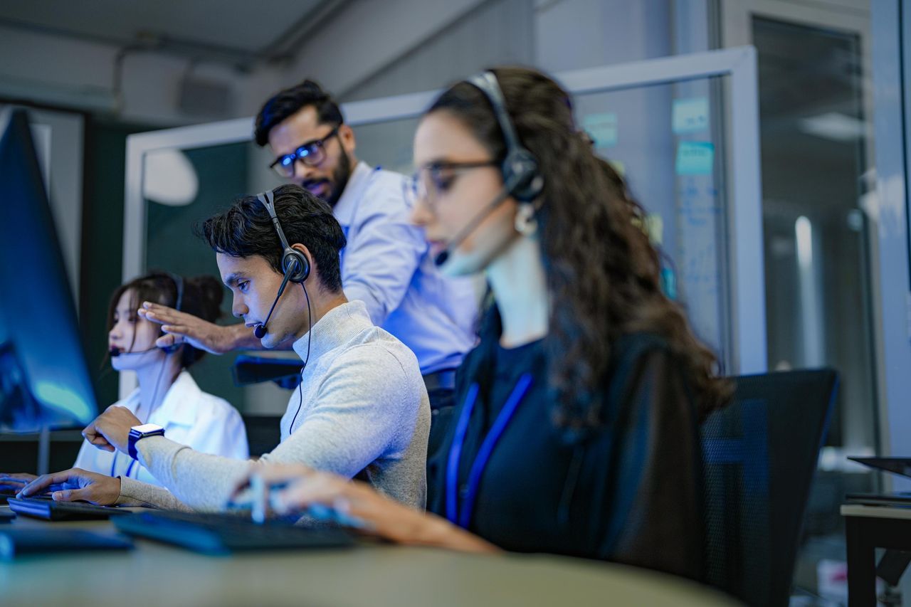 Contact center agents with headsets
