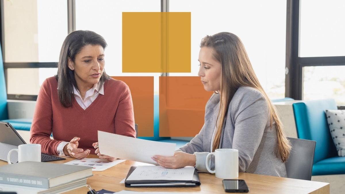 Advisor and client reviewing documents together
