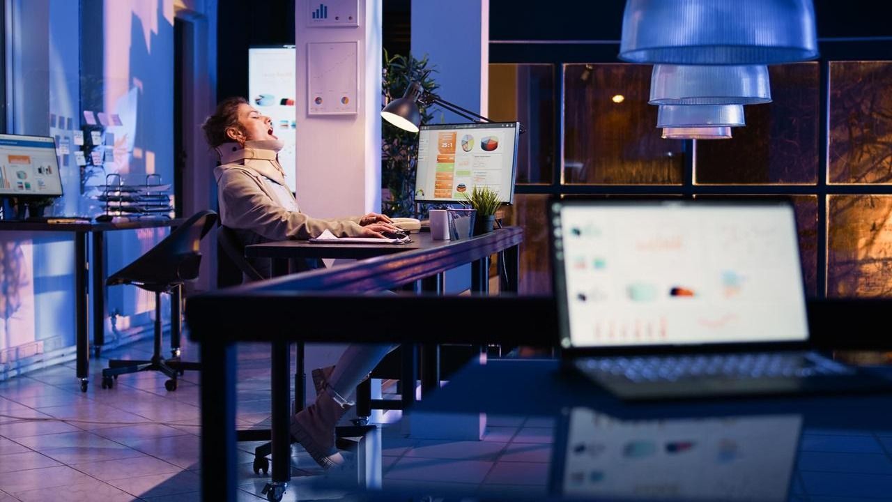 Office worker at a desk late in the evening