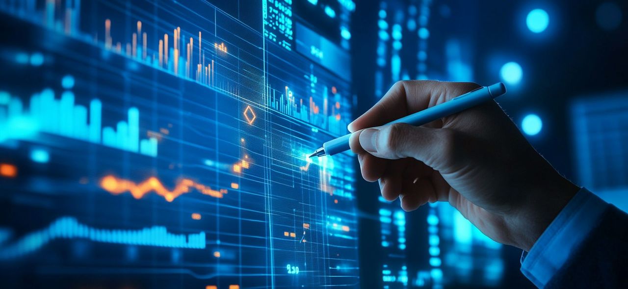 Hand analyzing charts on a digital display